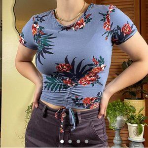 Deep blue crop top with a fun tropical floral pattern.